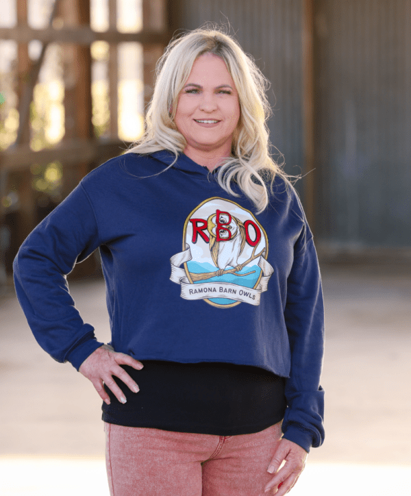 Woman Wearing Cropped Hoodie with Red Owl Logo in Navy